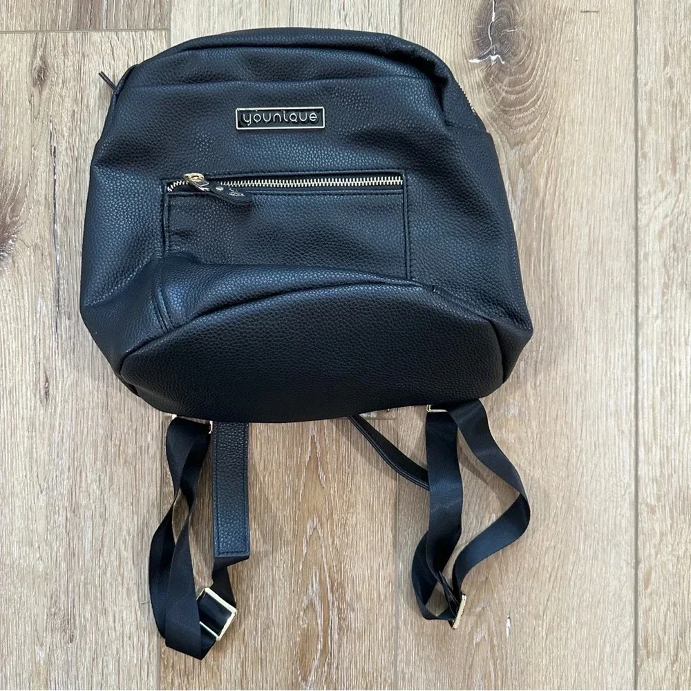 Younique Women’s Black Faux Leather Backpack with gold Zipper & Logo Details GUC